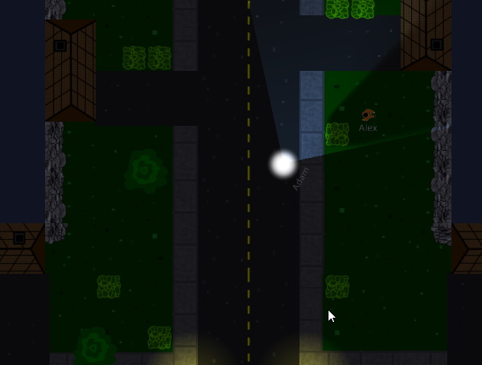 A flashlight cone sweeping toward a fugitive crouched in a dark hedge beside a house.