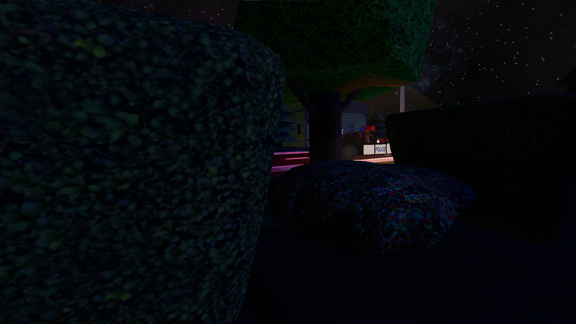 First person view from inside a dark hedge, with a police car visible through a gap between the leaves.